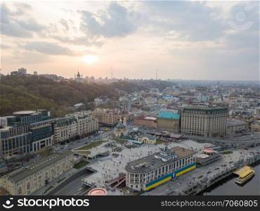 Panoramic view of St. Andrew&rsquo;s Church on the Andreev Mountain and the Ministry of the Interior and the Postal Square with St. Elijah Church in Kiev, Ukraine. Photo by drone. From the bird&rsquo;s eye view of the river station, Postal Square with St. Elijah Church , tourist boats and the Andreev Church on the hill in city Kiev, Ukraine.