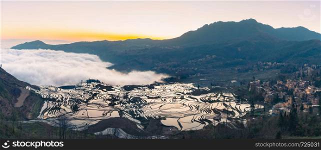 Panoramic view of Terraced rice fields of YuanYang , China with sea of fog and cloud