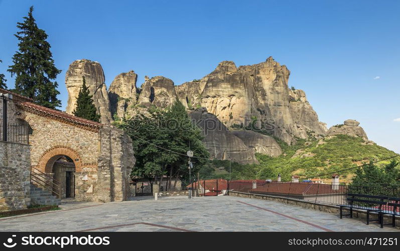 Panoramic view of the Assumption of Virgin Mary byzantine church in Meteora, Kalambaka town in Greece, on a sunny summer day. Ancient Byzantine church in Meteora, Greece