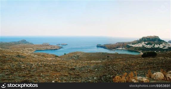 Panoramic view of the bay of the White City of Lindos, Rhodes Island, during sunset.
