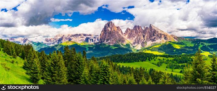 Panoramic view of the beautiful Langkofel Group of the Dolomites and the green alpine plateau Seiser Alm in South Tyrol Italy