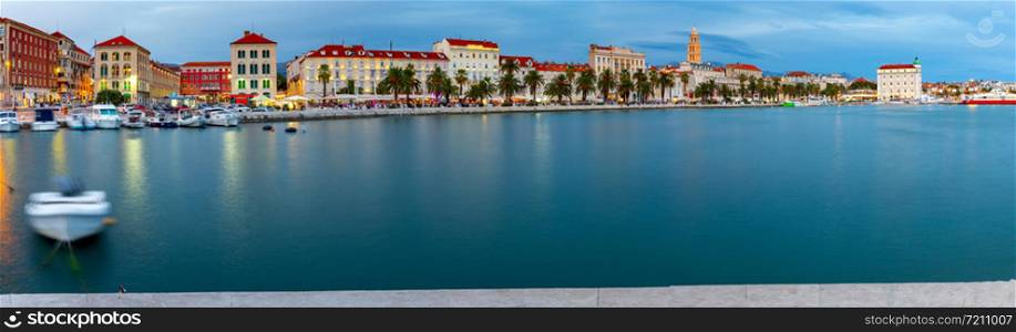 Panoramic view of the city and the city promenade in the night light at sunset. Split Croatia.. Split Panorama of the city and city promenade at sunset.