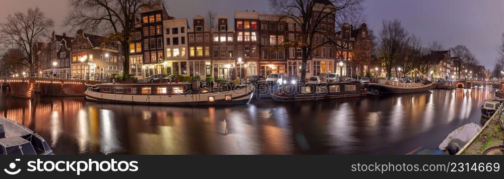 Panoramic view of the city embankment and the facades of houses in the fog on the Amstel canal. Amsterdam. Netherlands.. Panorama of the city waterfront of Amsterdam on a foggy morning.