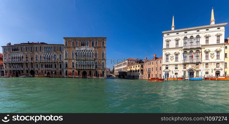 Panoramic view of the grand canal and the facades of medieval houses on a sunny day. Venice. Italy.. Venice. Panorama of the Grand Canal.