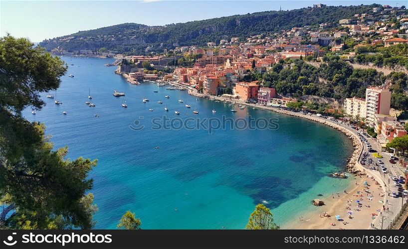 Panoramic view of the harbor town of Villefranche sur Mer, a coastal resort city on the Mediterranean Sea on the French Riviera, France