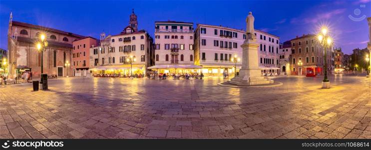 Panoramic view of the old city and medieval square in night illumination. Venice. Italy.. Venice. Panorama. Old Town Square at sunset.