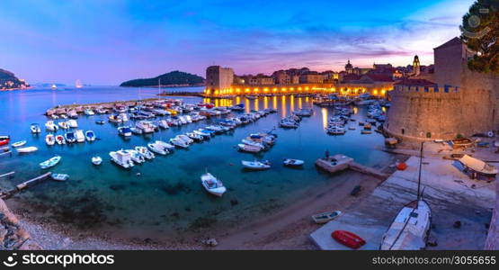 Panoramic view of The Old Harbour and Fort St Ivana at sunset in Dubrovnik, Croatia. Old Harbor of Dubrovnik, Croatia