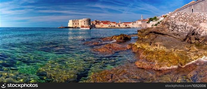 Panoramic view of The Old Harbour and Fort St Ivana in sunny day in Dubrovnik, Croatia. Old Harbor of Dubrovnik, Croatia