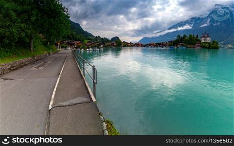 Panoramic view of the Swiss village of Iseltwald on the famous lake Brienz. Switzerland.. Panorama of the Swiss village of Iseltwald on the famous lake Brienz.