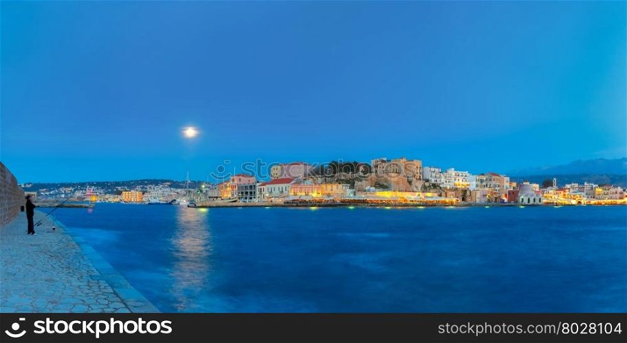 Panoramic view of Venetian quay of Chania at moonlit night, Crete, Greece