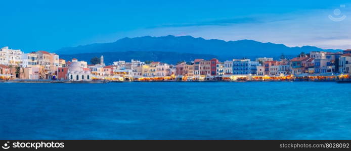 Panoramic view of Venetian quay of Chania with Kucuk Hasan Pasha Mosque during twilight blue hour, Crete, Greece