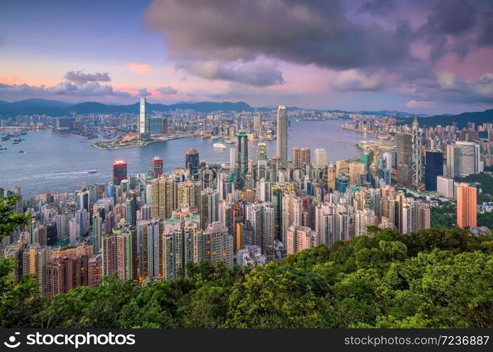 Panoramic view of Victoria Harbor and Hong Kong skyline in China at sunset