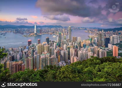 Panoramic view of Victoria Harbor and Hong Kong skyline in China at sunset