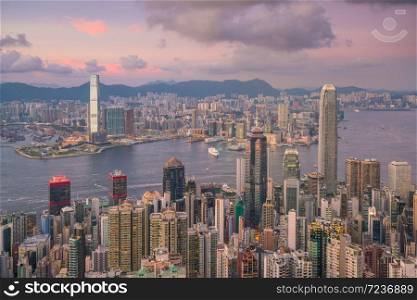 Panoramic view of Victoria Harbor and Hong Kong skyline in China at sunset