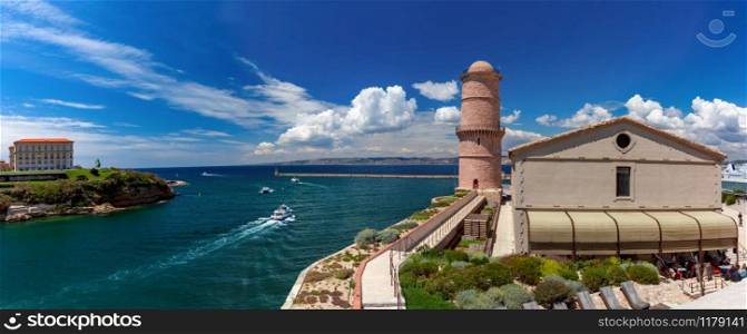 Panoramic view of Vieux Port, Old Port of Marseille with Fort Saint-Jean and former Lighthouse Tower, Marseille, Provence, south France. Old Port and Fort Saint-Jean, Marseille, France