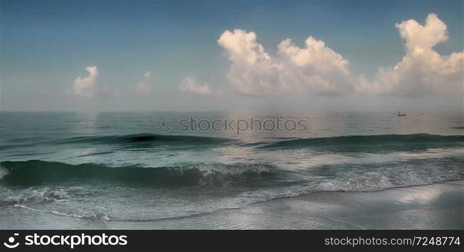 Panoramic view of waves breaking on shore