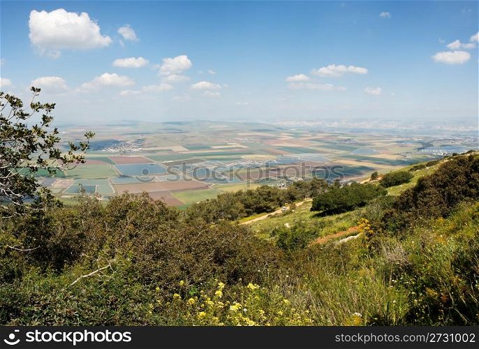 Panoramic view on patchwork of fields from Gilboa mountain in Galilee, Israel