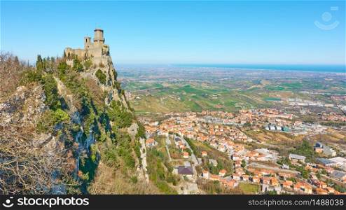 Panoramic view with the first tower of San Marino and Borgo Maggiore at the foot of rock - Landscape
