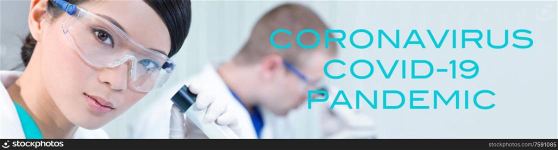 Panoramic web banner Chinese Asian female scientist, woman scientific researcher or doctor using a microscope in a medical research lab or laboratory with her colleague behind her panorama with Coronavirus Covid-19 Pandemic text