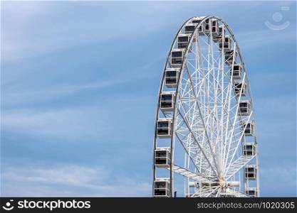Panoramic wheel on a light blue sky background