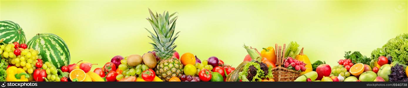 Panoramic wide collection fruits and vegetables for skinali on blur green background
