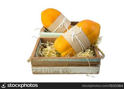Papaya fruit in wood box isolated on white with clipping path