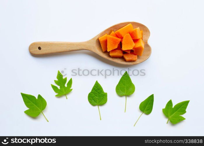 Papaya fruit with leaves on a white background.