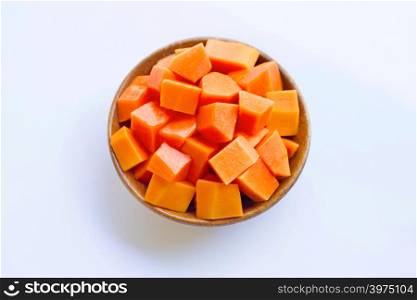 Papaya in wooden bowl on white background