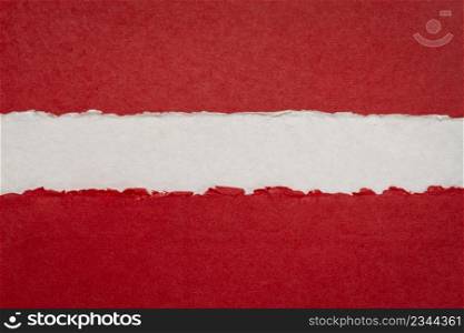 paper abstract in colors of Latvia national flag - red, white and red, set of textured, handmade paper sheets