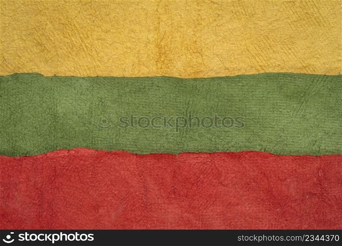 paper abstract in colors of Lithuania national flag - yellow, green and red, set of textured, handmade paper sheets