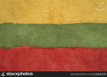 paper abstract in colors of Lithuania national flag - yellow, green and red, set of textured, handmade paper sheets