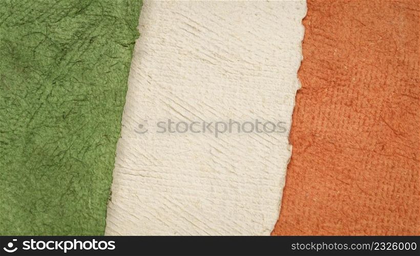 paper abstract in colors of national flag of Ireland (green, white and orange), collection of handmade bark paper sheets