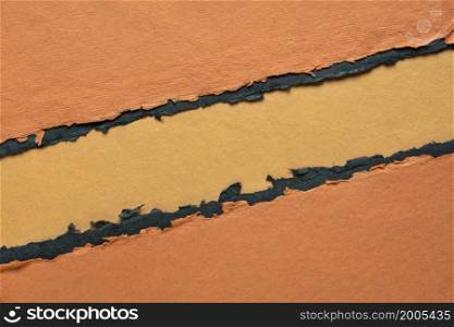 paper abstract in orange and black with a copy space - sheets of handmade paper, diagonal blank web banner, warning, alert and danger concept