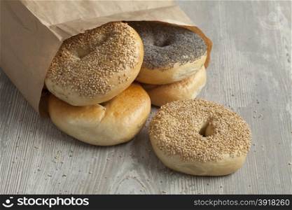 Paper bag with fresh variety of New York bagels