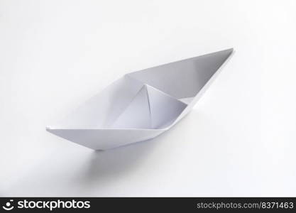 Paper boat origami isolated on a blank white background.. Paper boat origami isolated on a white background