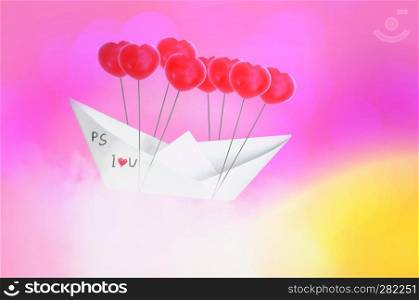Paper boat with red heart shape balloon  flying on Blue sky and clouds. Concept Valentine’s day , Sweet dream