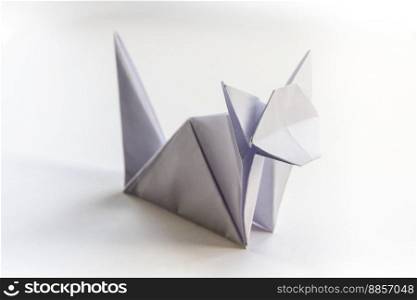 Paper cat origami isolated on a blank white background.. Paper cat origami isolated on a white background