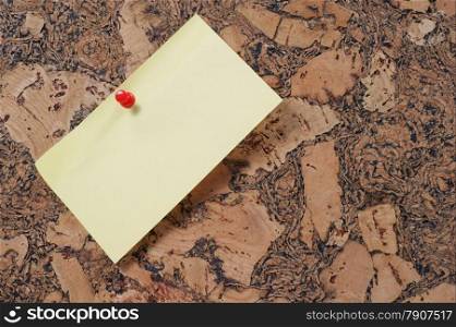 paper clip and push pin on cork noticeboard