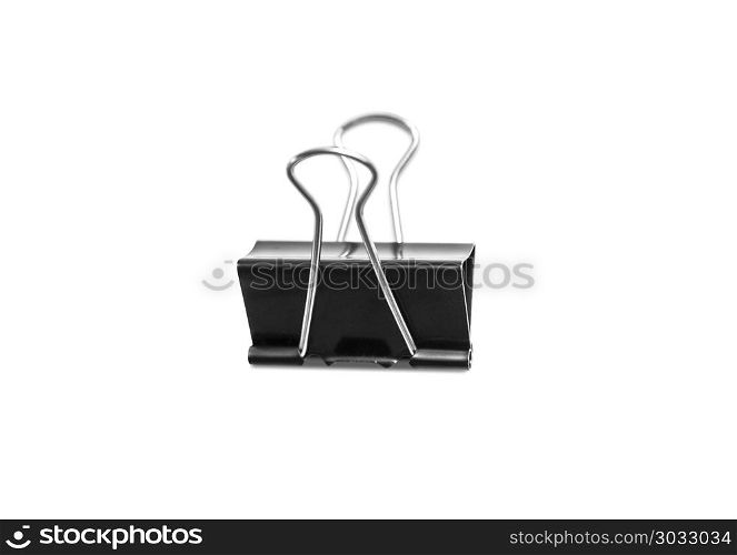Paper clip isolated from white background. Paper clip isolated from white background. A paperclip is a device for office use to clamp a device such as paper and more.