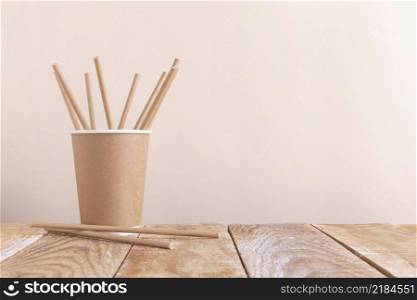 paper cup holding paper straws