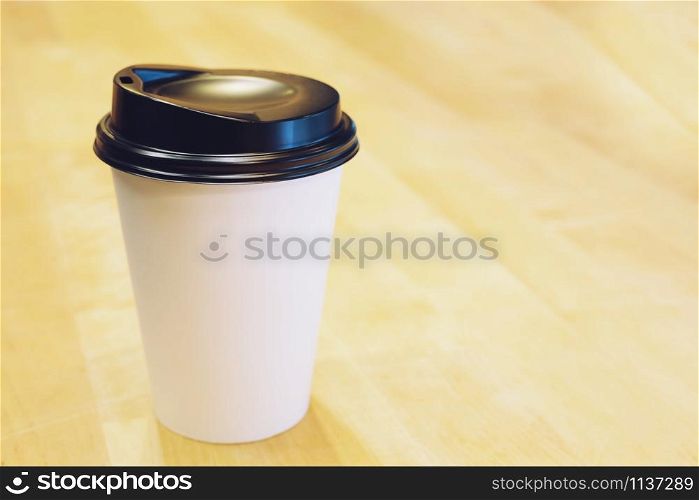 Paper cup of take away drinking coffee hot on cafe coffee shop.
