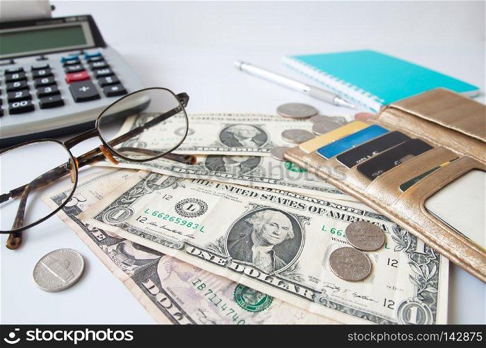 Paper currency, Coins and credit card in purse on workspace desk. Business and Financial