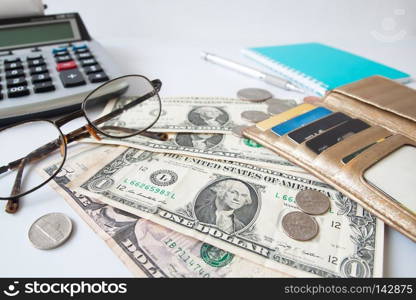 Paper currency, Coins and credit card in purse on workspace desk. Business and Financial