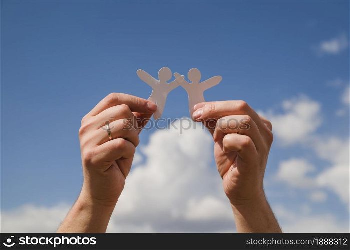 paper dolls against sky . Resolution and high quality beautiful photo. paper dolls against sky . High quality and resolution beautiful photo concept