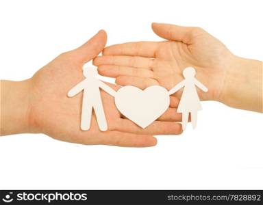 Paper family in hand with a big hearth isolated on white