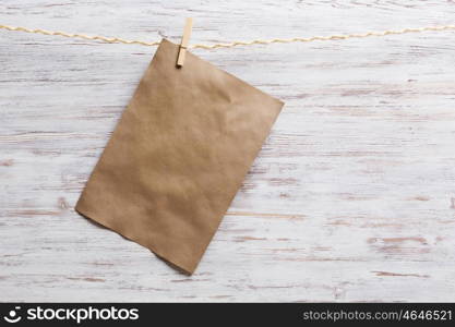 Paper hang on clothesline. Sheet of old paper hang on clothesline. Place your text