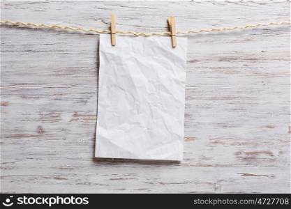 Paper hang on clothesline. Sheet of old paper hang on clothesline. Place your text