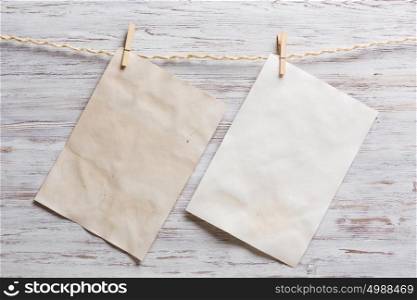 Paper hang on clothesline. Sheet of old paper hang on clothesline. Place your text
