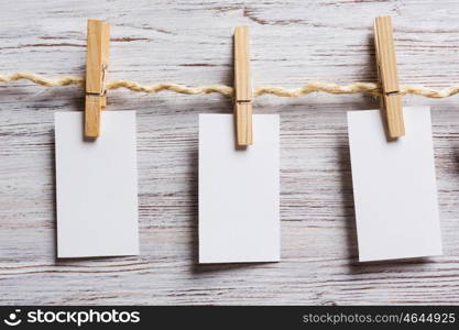 Paper hang on clothesline. Sheets of old paper hang on clothesline. Place your text