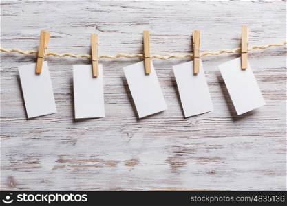 Paper hang on clothesline. Sheets of old paper hang on clothesline. Place your text
